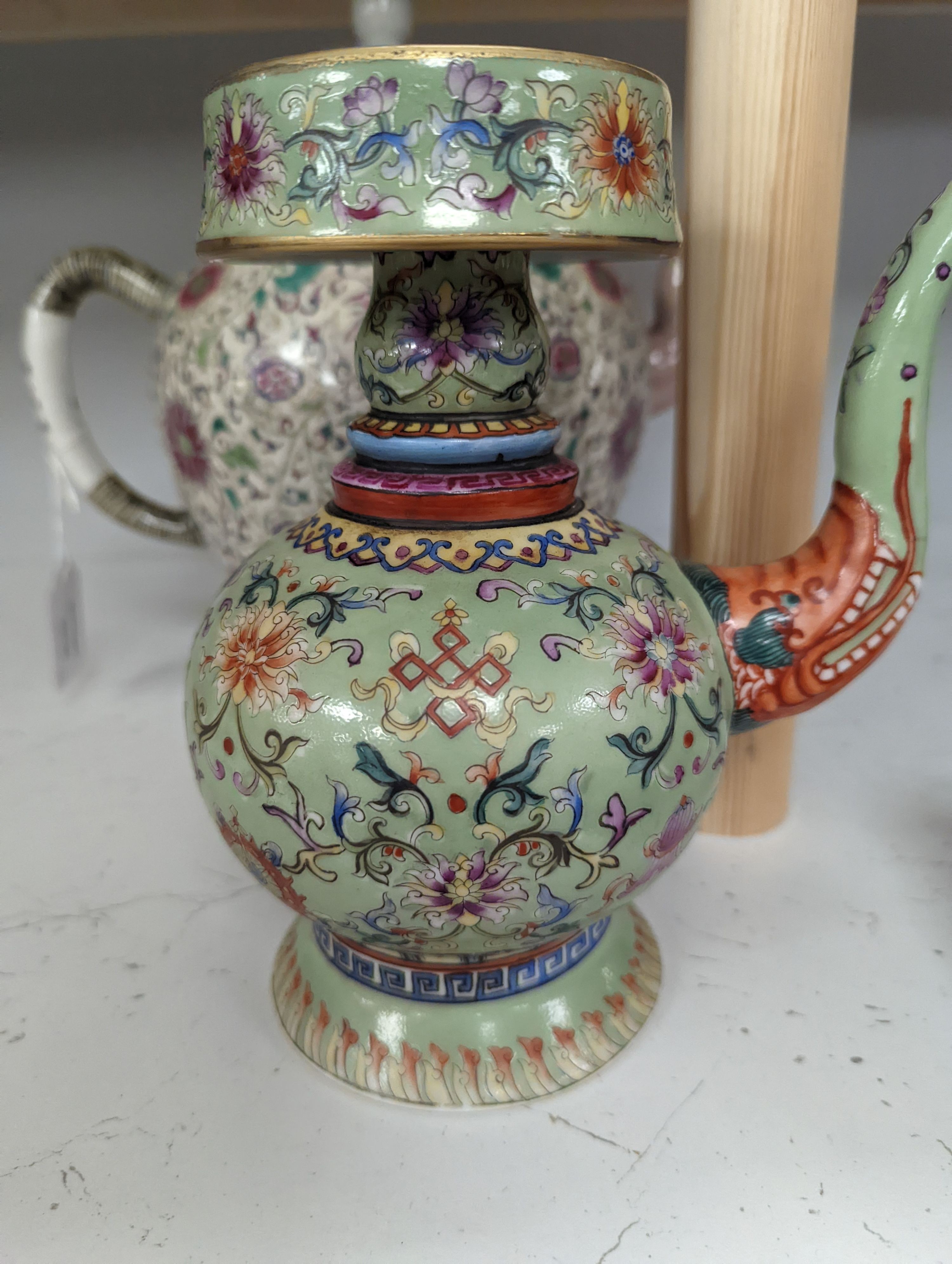 A large 19th century Chinese famille rose wine pot, and another wine pot, tallest 27cm